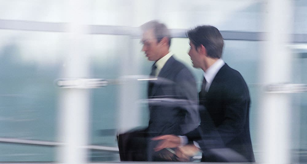 Two men walking and talking Two men walking and talking