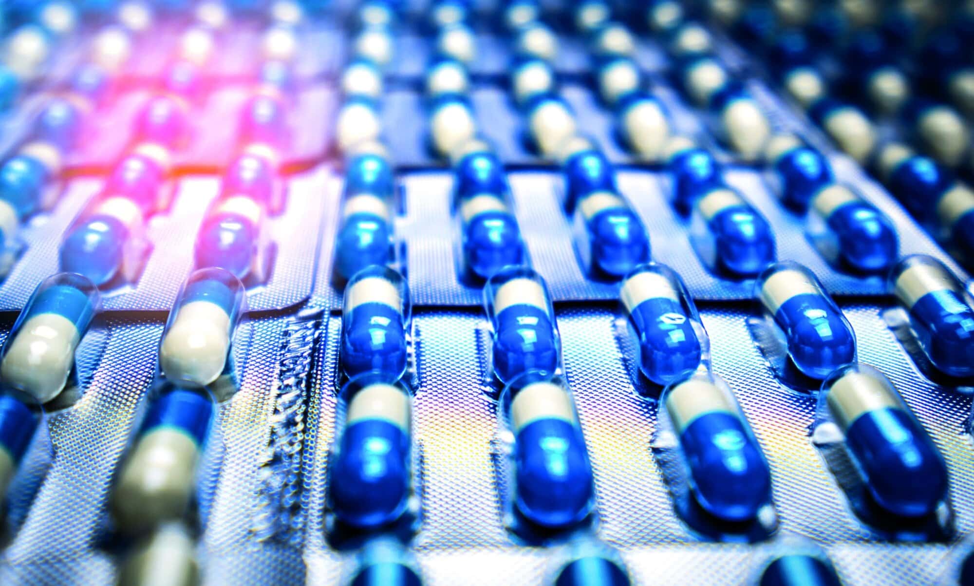 Blue,And,White,Capsule,Pills,In,Blister,Pack.,Pharmaceutical,Industry.